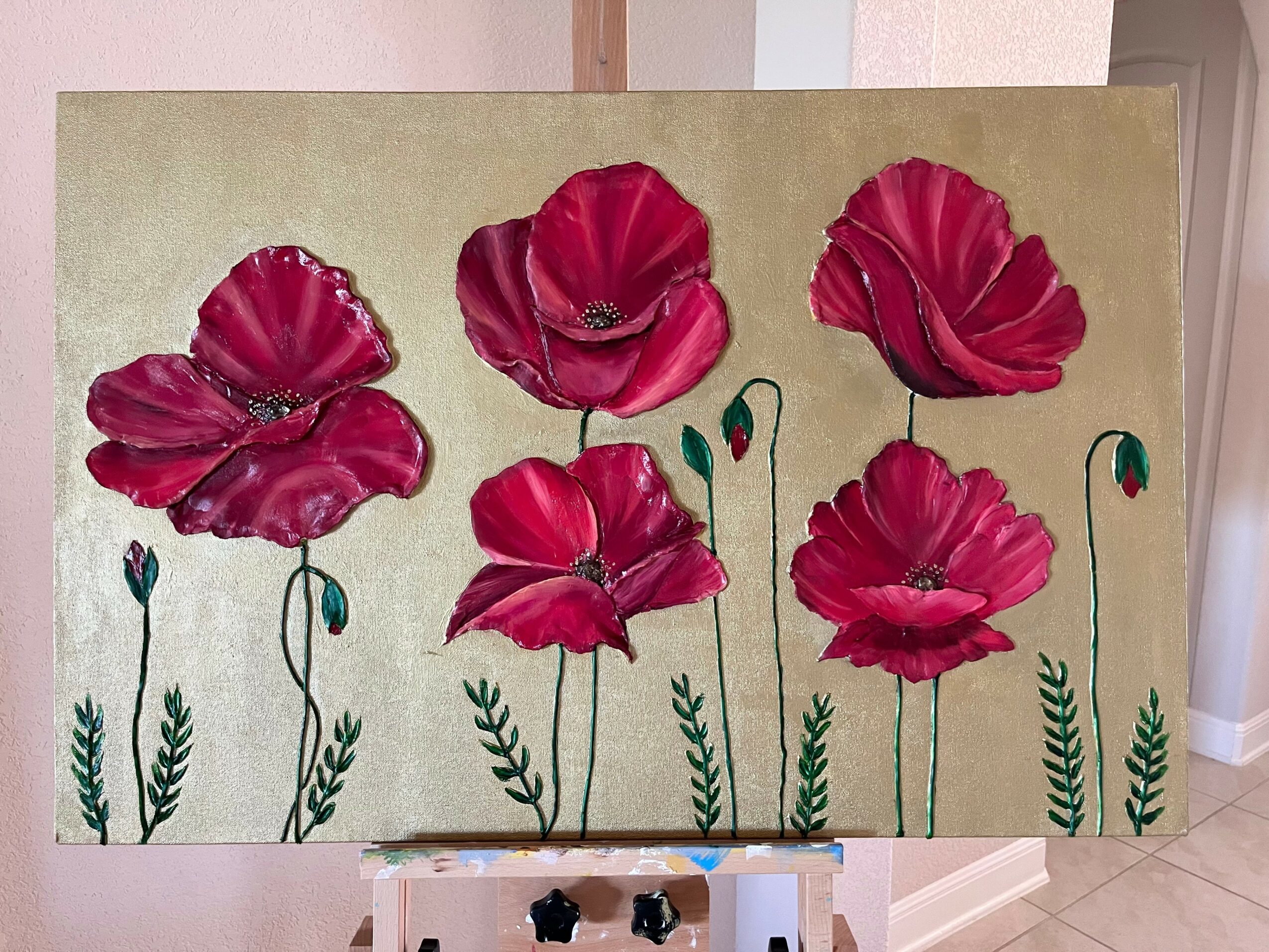 Painting of six red poppies with green stems on a beige background.
