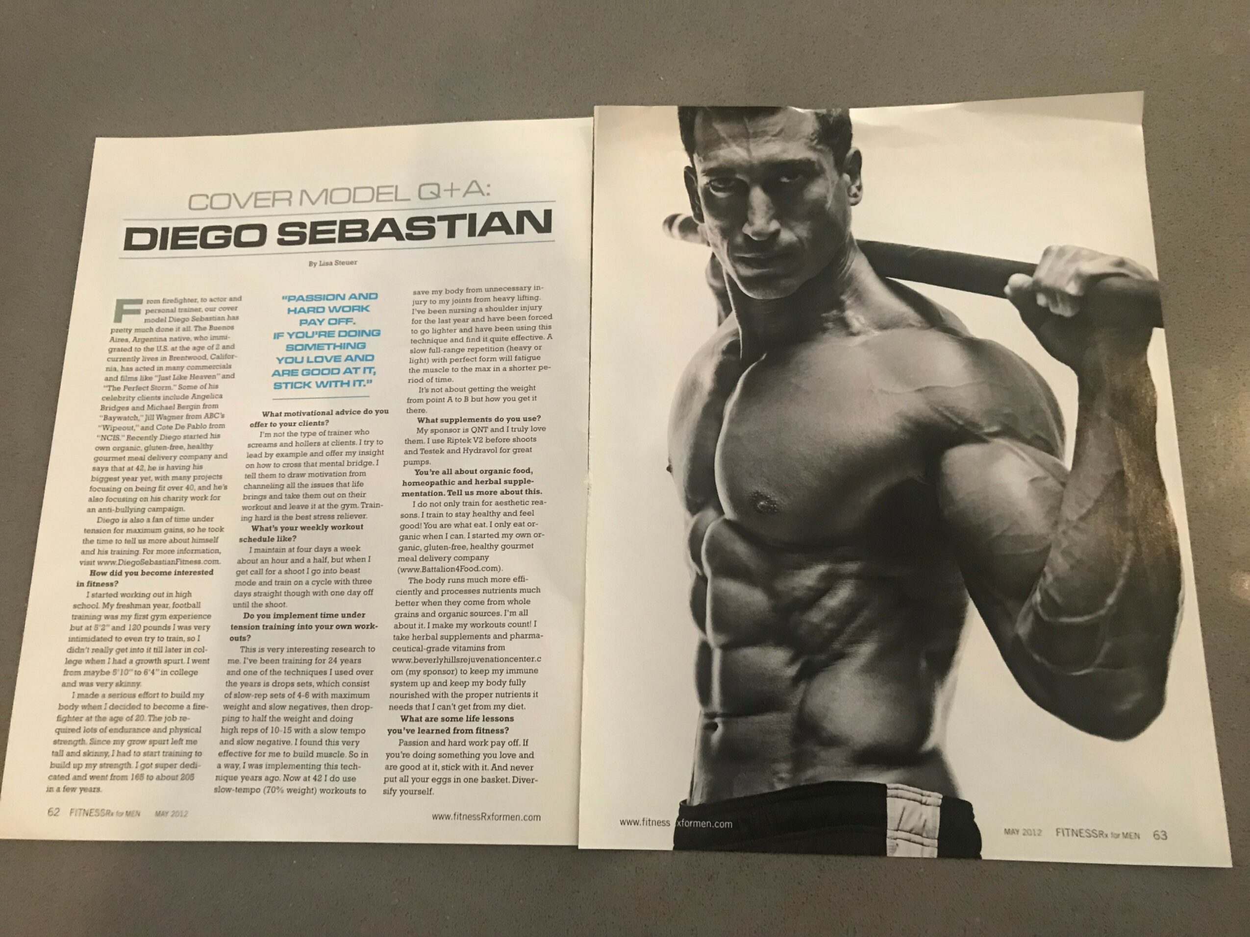 Open magazine spread featuring a black and white photo of a muscular man holding a baseball bat over his shoulder, with text on the left page.
