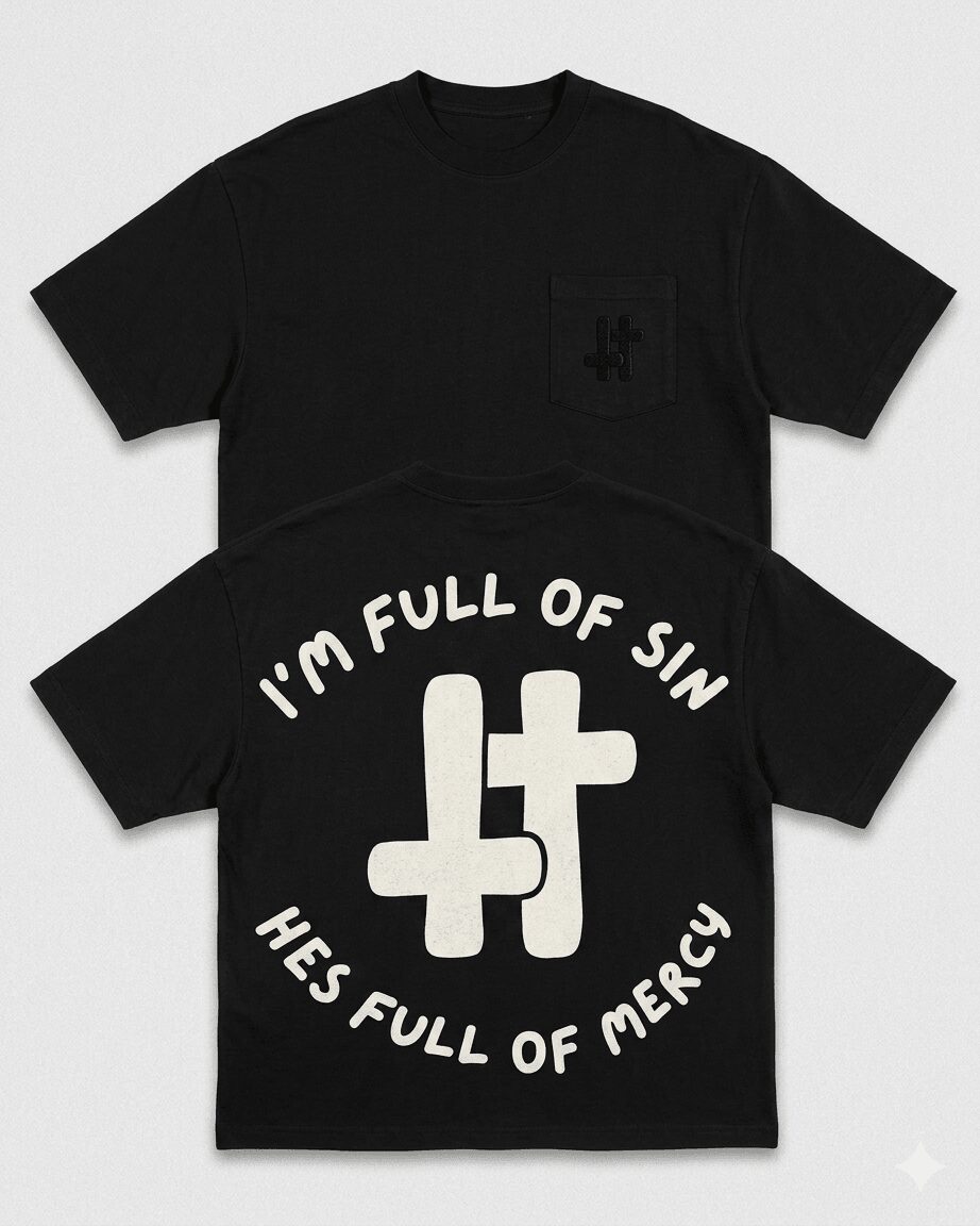 Black T-shirt with white text and a large cross symbol, reading 'I'm full of sin, he's full of mercy.'