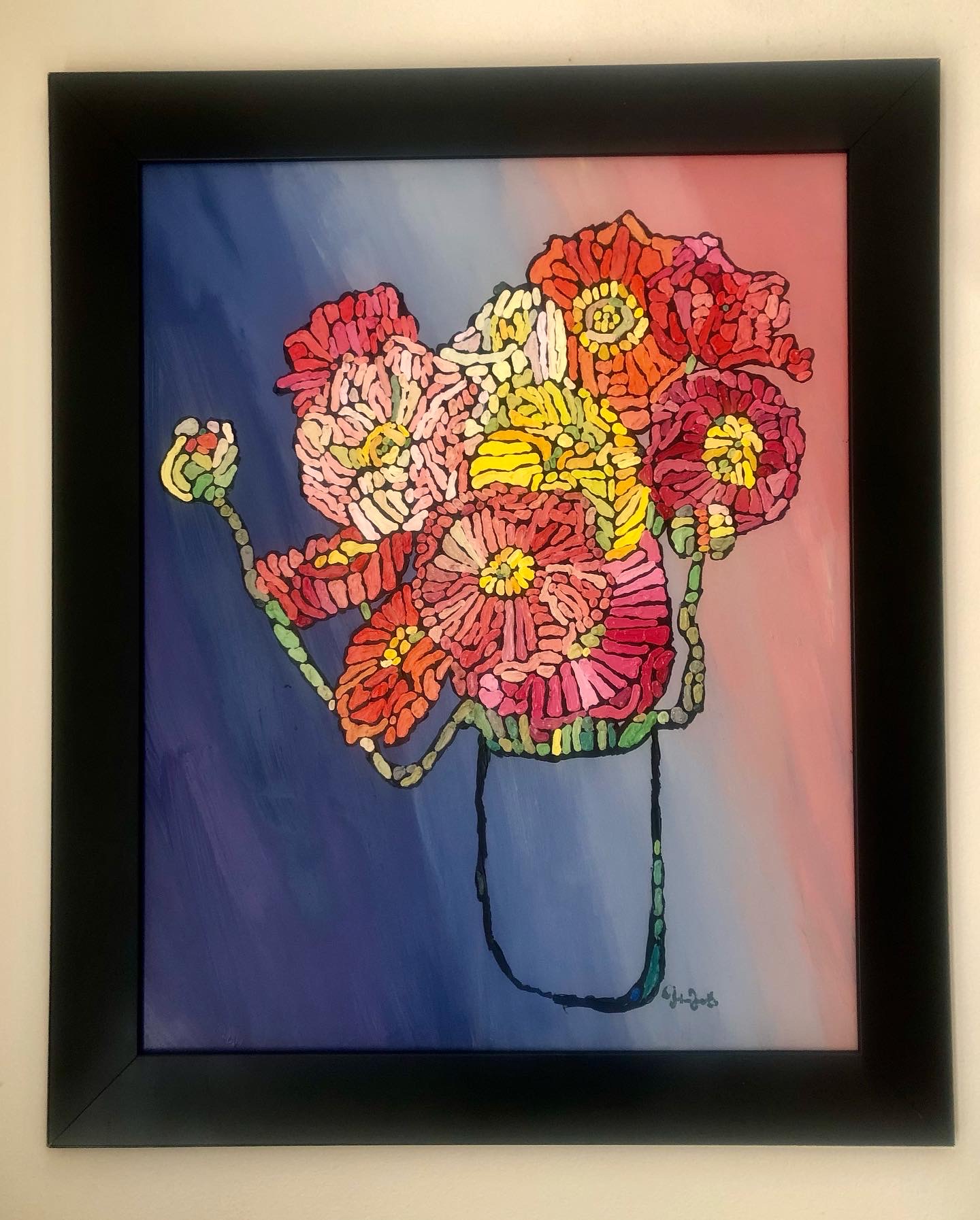 Framed colorful flower painting with pink, yellow, and red flowers in a vase against a gradient background.