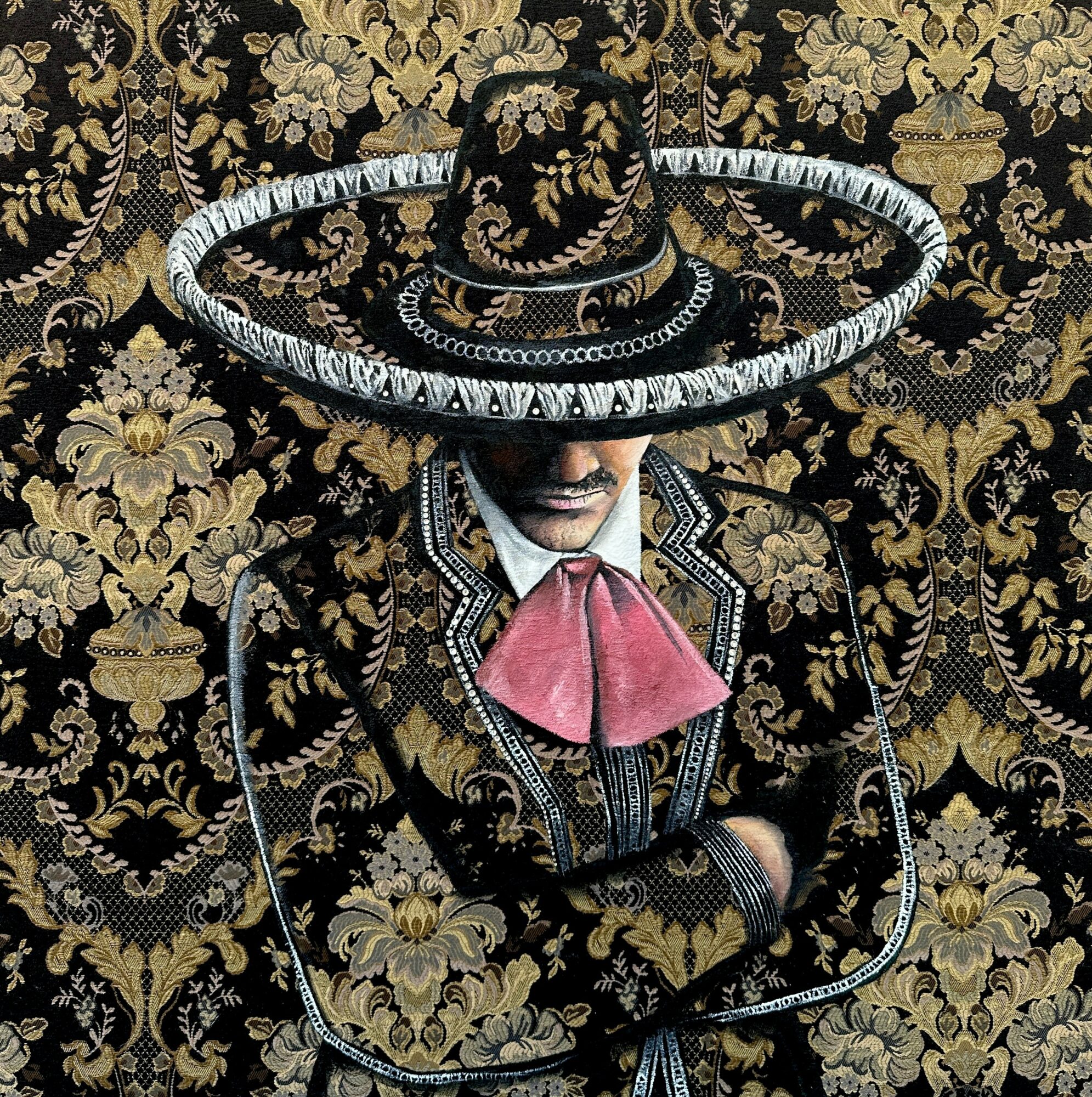 Person wearing a large sombrero and traditional Mexican attire, standing against a decorative patterned background.