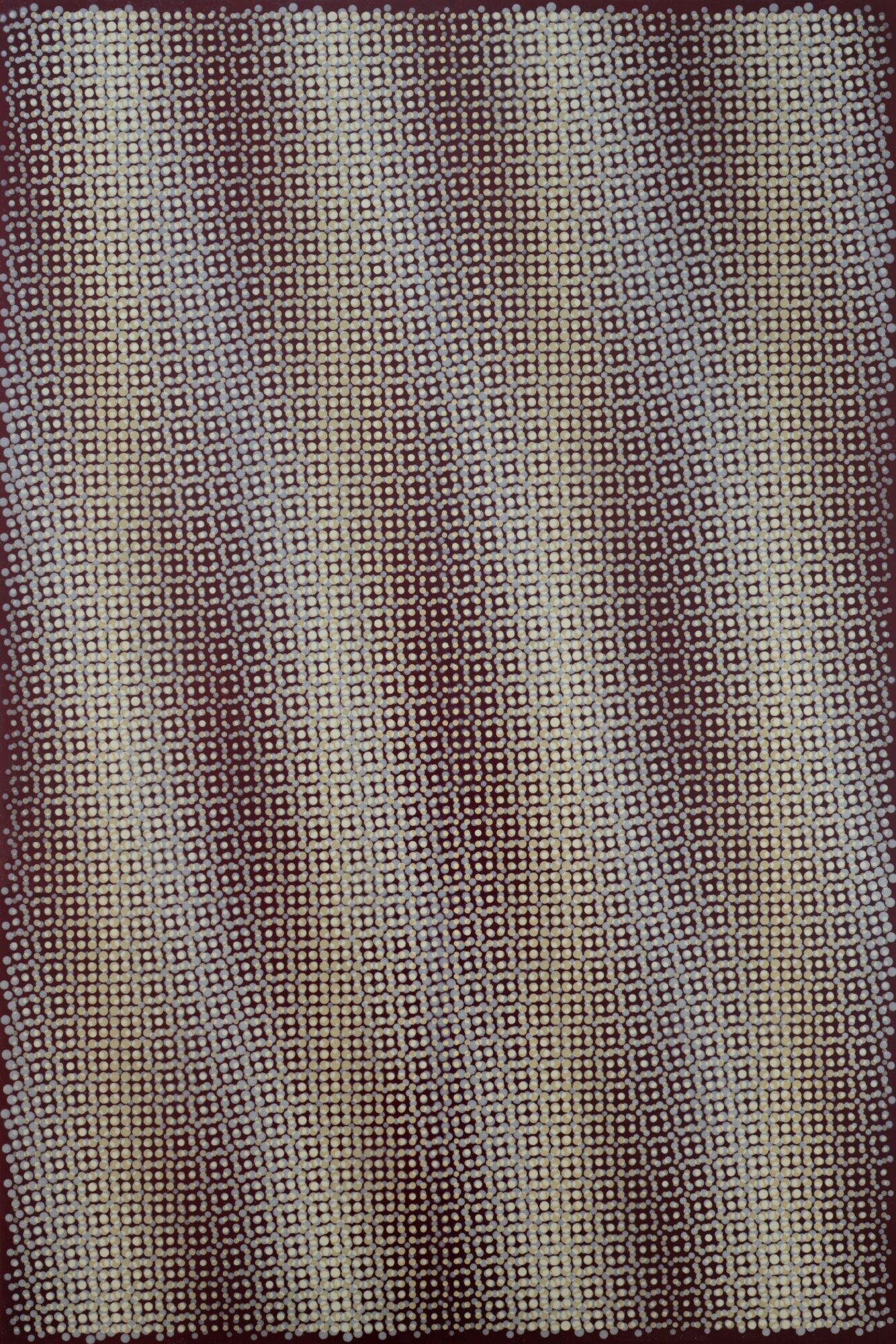Close-up of textured fabric with a repeating geometric pattern in neutral colors.
