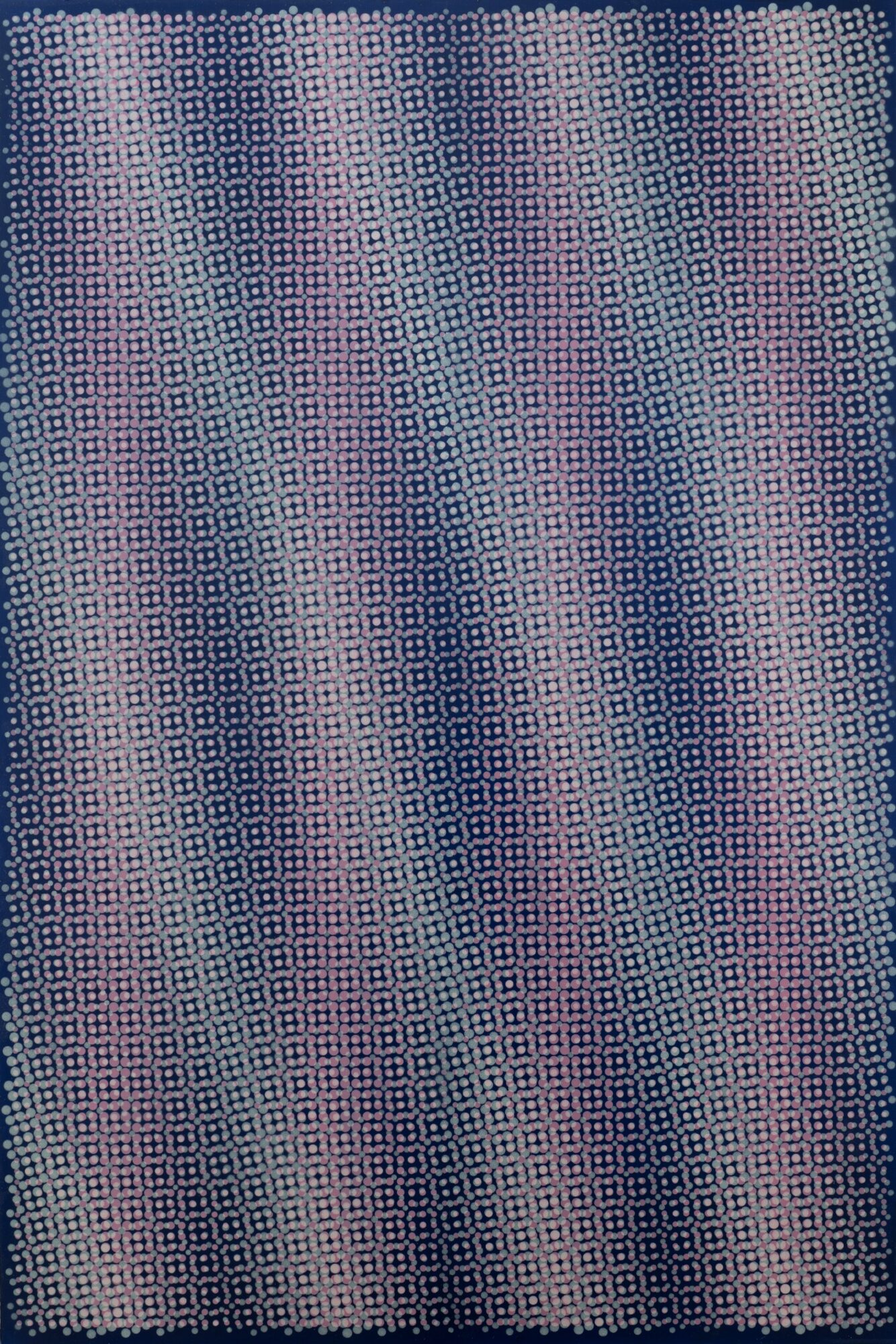 Close-up of a textured fabric with a pattern of small squares in shades of blue and pink.
