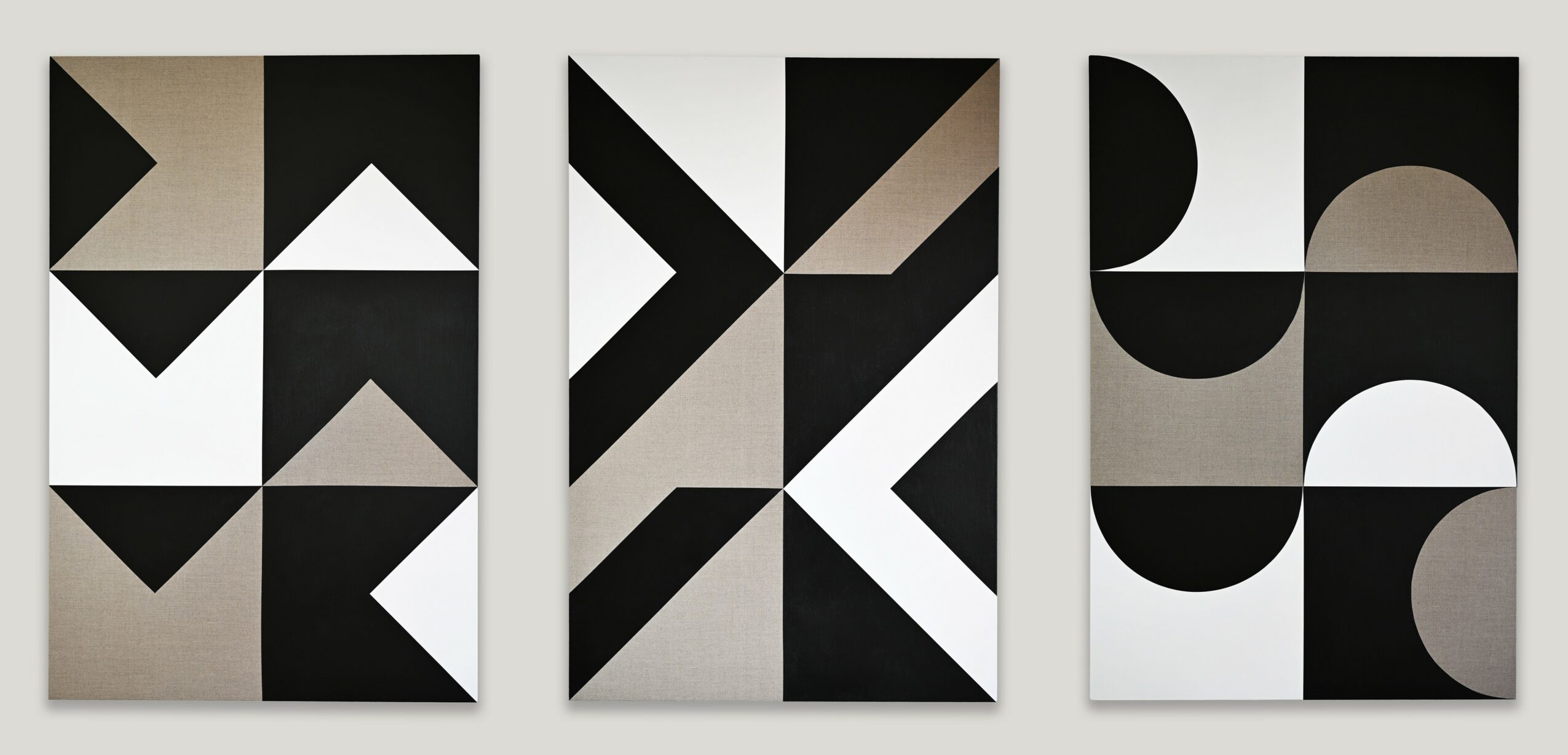 Three abstract geometric art pieces with black, white, and gray shapes arranged in patterns.
