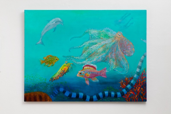 Underwater scene with various colorful fish and an octopus, blue water background, coral, and seaweed.